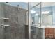 Updated bathroom features include a tiled walk-in shower with a glass partition and a vanity with great storage at 18118 Pompano Pl, Cornelius, NC 28031