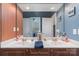 Elegant bathroom featuring double sinks with attractive faucets, cabinets and modern lighting at 18118 Pompano Pl, Cornelius, NC 28031