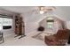 Cozy bedroom featuring neutral walls, a ceiling fan, chair, and a window with natural light at 18118 Pompano Pl, Cornelius, NC 28031