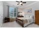 Comfortable bedroom offers great natural light from a window with beautiful white trim at 18118 Pompano Pl, Cornelius, NC 28031