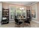 Bright breakfast nook features tile flooring, a chandelier and large windows for natural light at 18118 Pompano Pl, Cornelius, NC 28031
