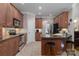 Kitchen featuring stainless steel appliances, tile flooring and dark countertops at 18118 Pompano Pl, Cornelius, NC 28031