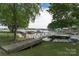 Picturesque waterfront view with multiple boat docks and calm waters, perfect for boating and enjoying nature at 18118 Pompano Pl, Cornelius, NC 28031