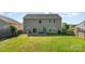 Spacious backyard featuring a patio and a seating area for outdoor entertainment at 1905 Yellow Daisy Dr, Matthews, NC 28104