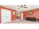 Spacious bonus room with new carpet, red wall, and a cozy seating area at 1905 Yellow Daisy Dr, Matthews, NC 28104
