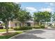 Community clubhouse featuring manicured landscaping, a covered entrance, and a playground at 1905 Yellow Daisy Dr, Matthews, NC 28104