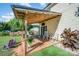 Inviting back deck with stylish seating, lush greenery, and ambient lighting for ultimate relaxation at 205 Wingate Dr, Stanley, NC 28164