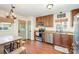 Functional kitchen with wooden cabinets, stainless steel appliances, and wood flooring at 205 Wingate Dr, Stanley, NC 28164