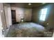 Living room with large window, hardwood floors, and a decorative fireplace at 210 Mahan Sw St, Concord, NC 28025