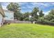 Expansive backyard featuring a large lawn, wooden fence, and storage shed at 2117 Yadkin Ave, Charlotte, NC 28205