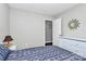 Comfortable bedroom featuring a full bed, a wall hanging, a dresser, and hardwood floors at 2117 Yadkin Ave, Charlotte, NC 28205