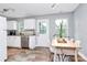Inviting dining area with tile flooring, a table, and a view of the outdoors at 2117 Yadkin Ave, Charlotte, NC 28205