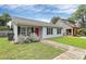 Charming single-story home with a manicured lawn, inviting entrance, and mature landscaping at 2117 Yadkin Ave, Charlotte, NC 28205
