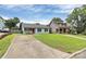 Charming single-story home with a spacious front yard, and sidewalk to entry at 2117 Yadkin Ave, Charlotte, NC 28205