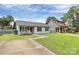Charming single-story home with a manicured lawn, inviting entrance, and mature landscaping at 2117 Yadkin Ave, Charlotte, NC 28205