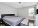 Spacious bedroom with neutral tones, hardwood flooring, and a bench at the end of the bed at 2117 Yadkin Ave, Charlotte, NC 28205