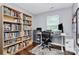 Well-lit office space with built-in bookshelves, a desk, and a comfortable office chair at 2117 Yadkin Ave, Charlotte, NC 28205