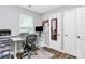 Bright office space with a desk, drawers, shelves, large windows, and stylish decor at 2117 Yadkin Ave, Charlotte, NC 28205