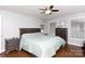 Cozy bedroom offers a ceiling fan, natural light, and comfortable space for relaxation at 2168 Sunset Cir, Fort Mill, SC 29715