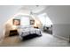 Cozy bedroom featuring an arched ceiling, ceiling fan, and neutral walls with a comfortable bed at 2168 Sunset Cir, Fort Mill, SC 29715