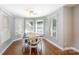 Bright dining room with bay windows and a table with decorative chairs at 2168 Sunset Cir, Fort Mill, SC 29715
