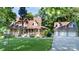 Charming home with a welcoming front porch, lush lawn, mature trees and a detached garage at 2168 Sunset Cir, Fort Mill, SC 29715