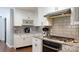 Modern kitchen featuring white cabinets, granite countertops, and stainless steel appliances at 2168 Sunset Cir, Fort Mill, SC 29715