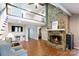 Open living area features a stone fireplace, vaulted ceiling, and seamless flow to other living spaces at 2168 Sunset Cir, Fort Mill, SC 29715