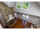Elevated view of the living room shows the stone fireplace, vaulted ceiling, and French doors at 2168 Sunset Cir, Fort Mill, SC 29715