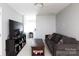 Relaxing living room with dark couch and TV entertainment area, ideal for Gathering time at 2168 Sunset Cir, Fort Mill, SC 29715