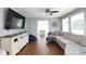 Comfortable living room with hardwood floors, a plush sofa, and a large TV at 2168 Sunset Cir, Fort Mill, SC 29715