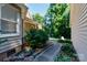 Landscaped yard with walking path and established shrubs at 2168 Sunset Cir, Fort Mill, SC 29715
