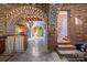 Finished basement boasting brick archways, exposed ceilings, and bar area at 217 S Ellis St, Salisbury, NC 28144