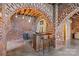 Finished basement with exposed brick archways, bar area, and adjacent seating space at 217 S Ellis St, Salisbury, NC 28144