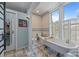 Bright bathroom featuring patterned tile, clawfoot tub, bidet and vintage decor at 217 S Ellis St, Salisbury, NC 28144