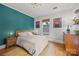 Cozy bedroom featuring hardwood floors, modern decor, and natural light at 217 S Ellis St, Salisbury, NC 28144