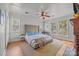 Bright bedroom with multiple windows, hardwood floors, and a cozy atmosphere at 217 S Ellis St, Salisbury, NC 28144