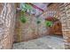 Brick courtyard with hanging plants and rock floor at 217 S Ellis St, Salisbury, NC 28144