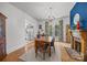 Inviting dining room with hardwood floors, chandelier, and colorful accent wall at 217 S Ellis St, Salisbury, NC 28144