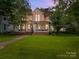 Charming two-story home with a welcoming front porch and lush green lawn at 217 S Ellis St, Salisbury, NC 28144