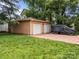 Two car garage with concrete driveway and lawn at 217 S Ellis St, Salisbury, NC 28144