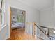 Hallway view leading into a bedroom with hardwood floors and natural light at 217 S Ellis St, Salisbury, NC 28144