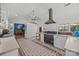 Open concept kitchen features modern appliances, white cabinets, and tiled floors at 217 S Ellis St, Salisbury, NC 28144