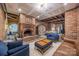 An inviting living room with a brick fireplace, cozy seating, and an open archway leading to another room at 217 S Ellis St, Salisbury, NC 28144