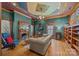 Unique living room with a decorative ceiling, fireplace, and hardwood floors at 217 S Ellis St, Salisbury, NC 28144