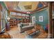 Elegant living room featuring a decorative ceiling and ample shelving at 217 S Ellis St, Salisbury, NC 28144