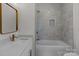 This primary bathroom features a shower-tub combination with marble walls and updated sink and faucet at 2220 Mooresville Rd, Salisbury, NC 28147
