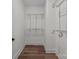 This walk-in closet features shelving and wood flooring for ample storage space and organization at 2220 Mooresville Rd, Salisbury, NC 28147