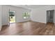 Bright living room features wood flooring, multiple windows, and a light and airy feel at 2220 Mooresville Rd, Salisbury, NC 28147