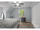 Cozy bedroom with neutral colors, a window offering natural light, and ample closet space at 223 Tennessee Trl, Lincolnton, NC 28092